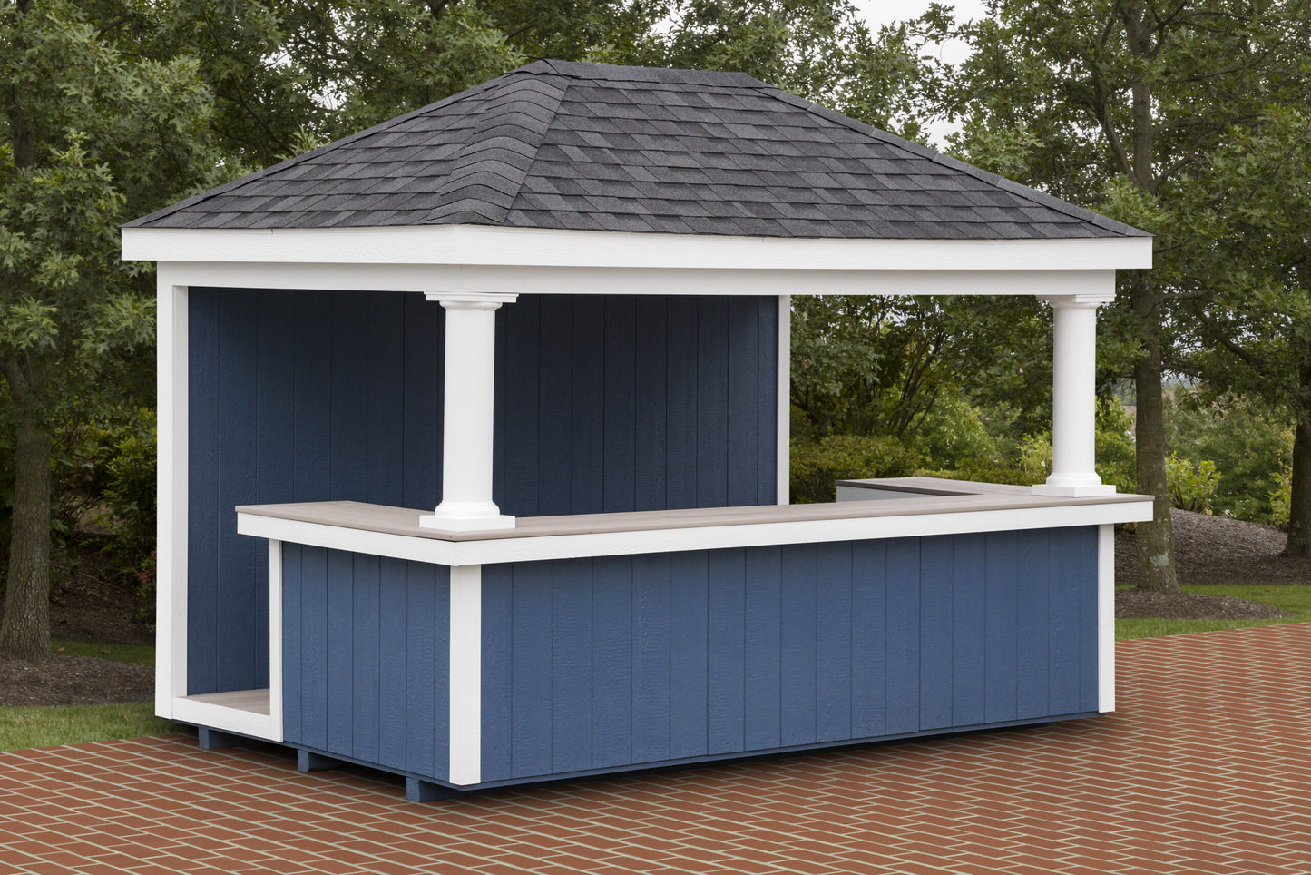 Blue outdoor gazebo with white trim on a brick patio