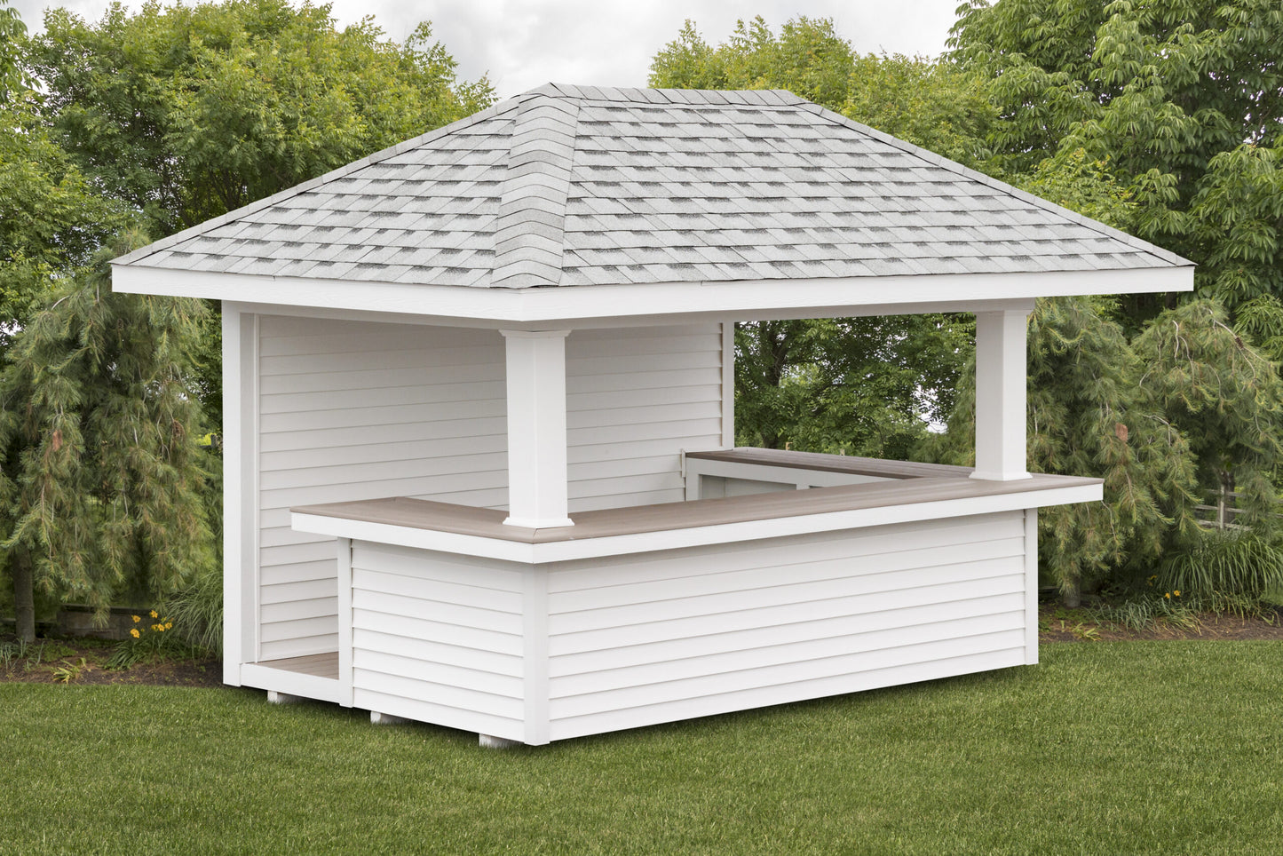 White wooden gazebo with a roof in a garden setting