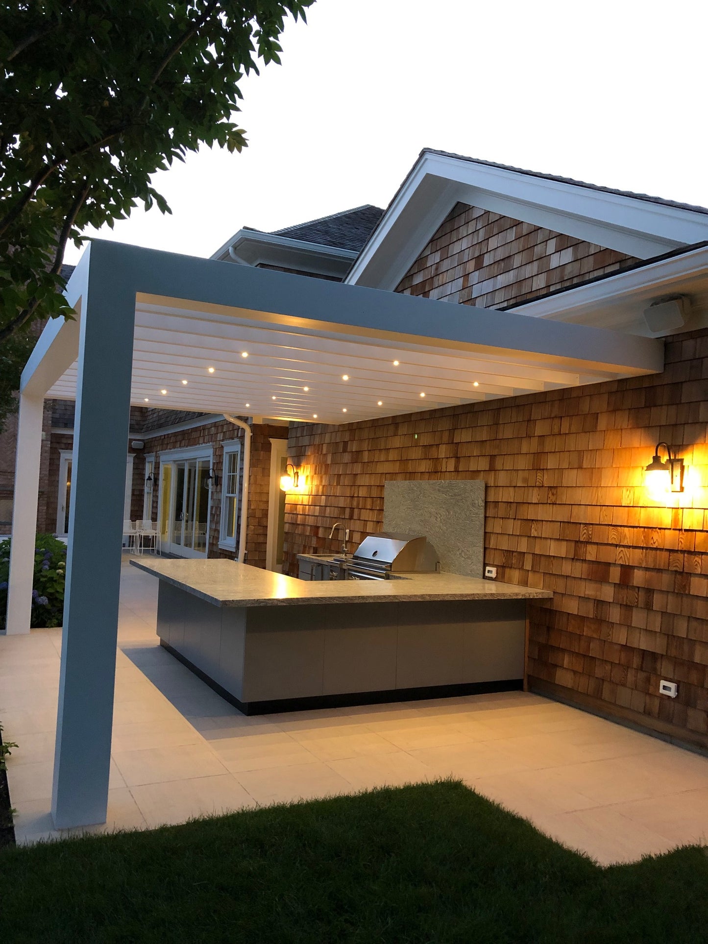 Top-down view of a house exterior with a well-lit entrance.