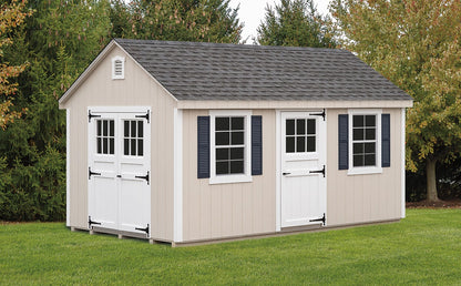 Beige storage shed with white doors and windows in a garden setting