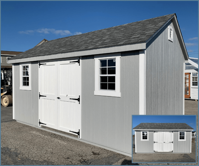 An 8x12 deluxe shed with gray and white siding, double doors with transom windows, and a shingle roof.