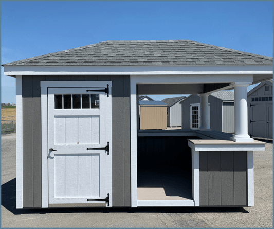 An 8x12 Limerick Pool Shed with a high bar, aluminum transom window, and SmartSide siding.