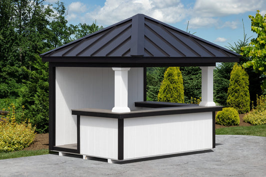 Gazebo with a black roof and white walls in a garden setting