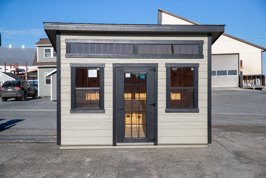 Small building with a door and windows on a clear day