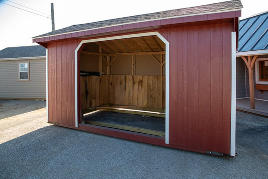 Red metal vinyl with open door on a concrete surface